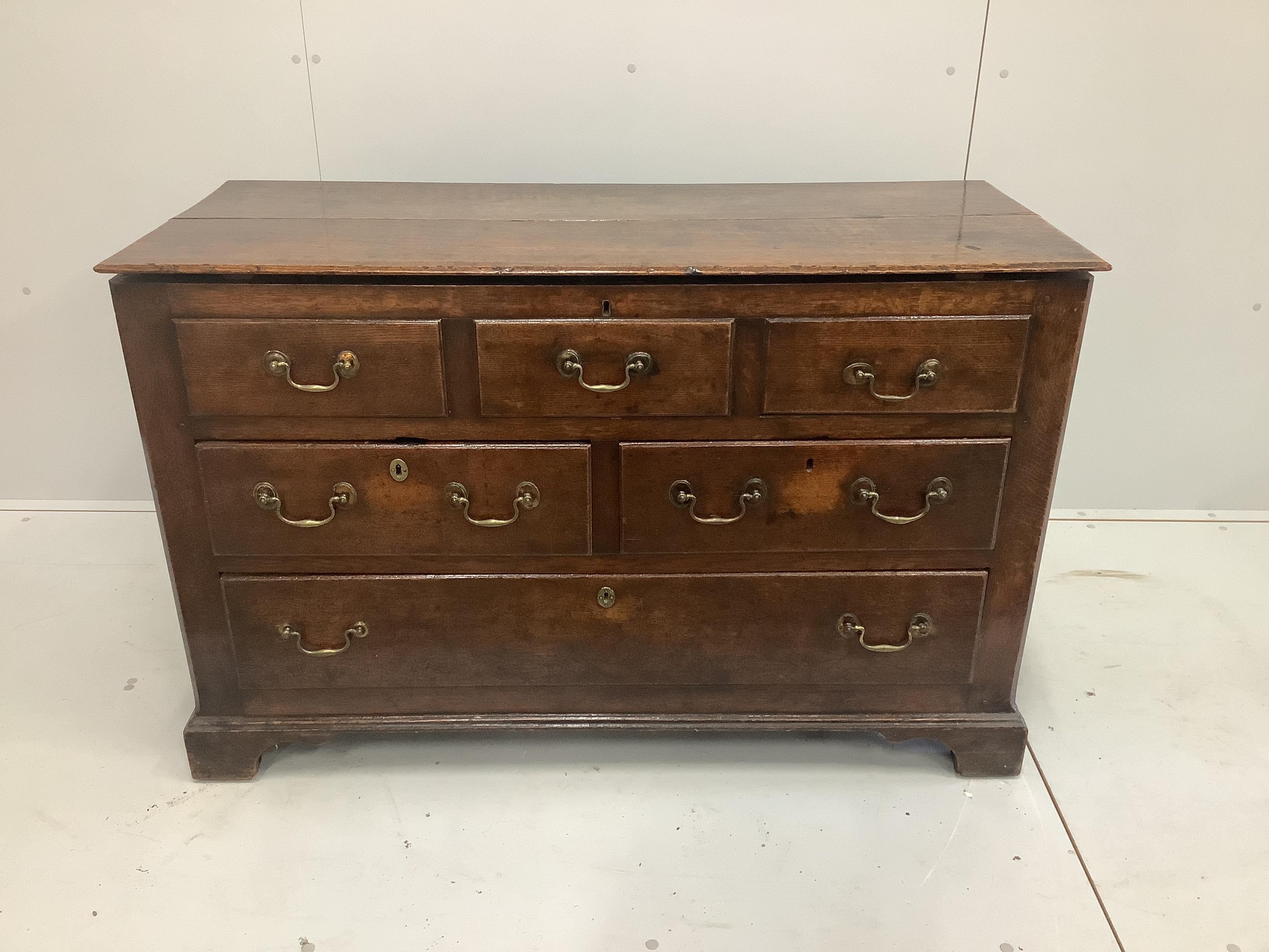 A mid to late 18th century oak mule chest with three dummy drawers over two short and one long drawer, width 121cm